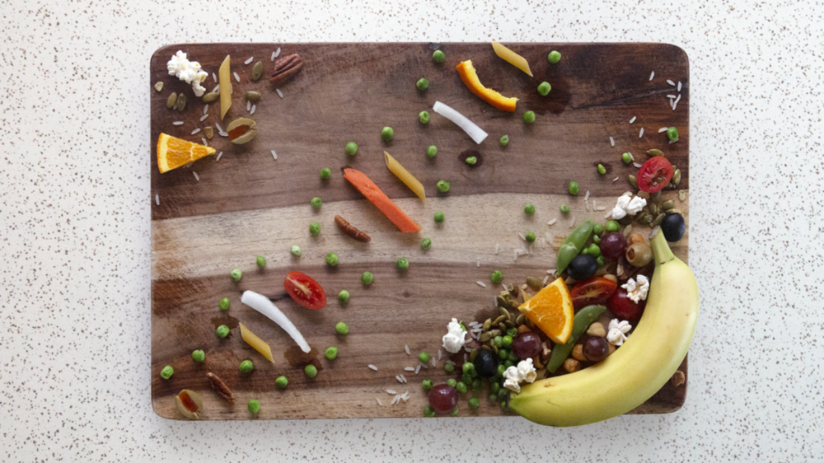 Food distributed on a cutting board.