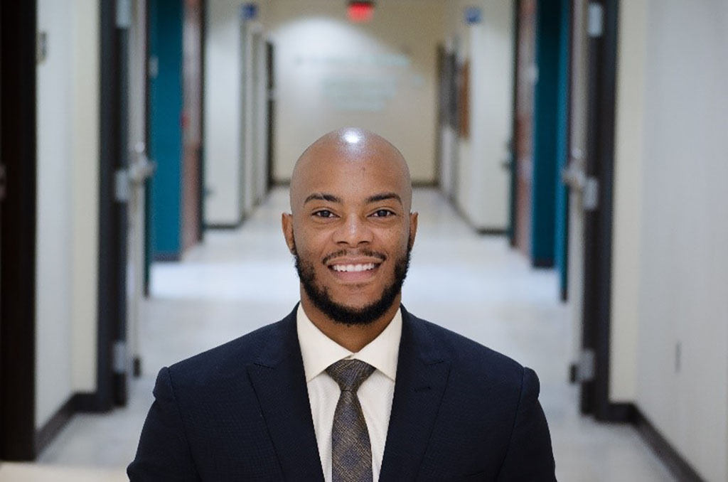 Lorenzo Hopper standing inside a hallway.