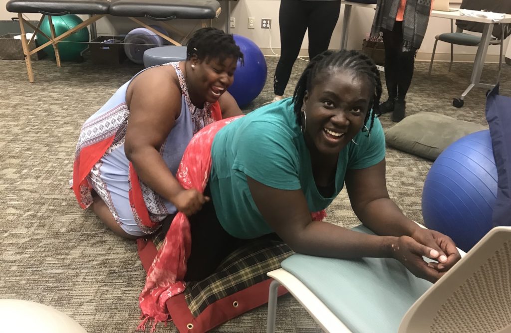Two women in doula training session