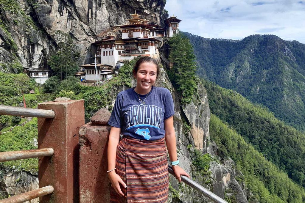 Alaina Plauche stands on a scenic mountain overlook in Bhutan.