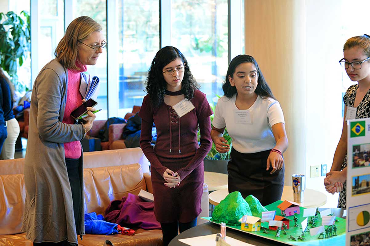 Students present a project at the FedEx Global Education Center on the campus of UNC-Chapel Hill.