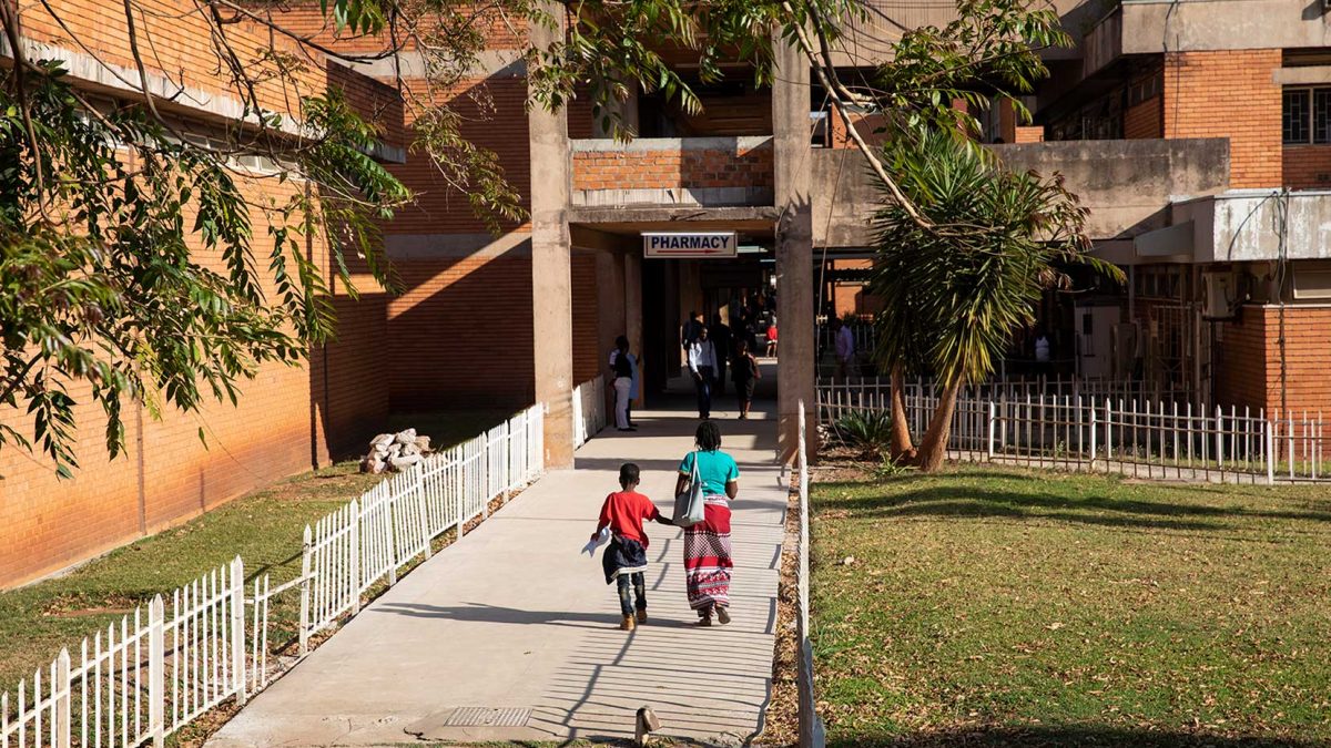 Patients walk into the University of Zambia School of Medicine Teaching Hospital in Lusaka, Zambia.