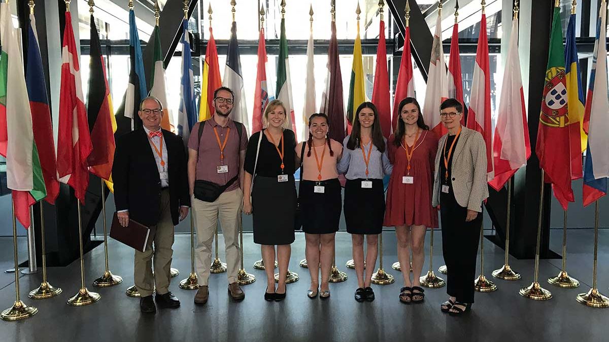 Five Carolina Law students, accompanied by Dean Martin Brinkley and Professor Lissa Broome at the Court of Justice of the European Union in Luxembourg.