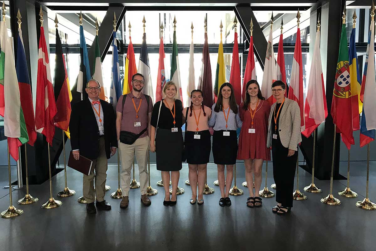 Five Carolina Law students, accompanied by Dean Martin Brinkley and Professor Lissa Broome at the Court of Justice of the European Union in Luxembourg.