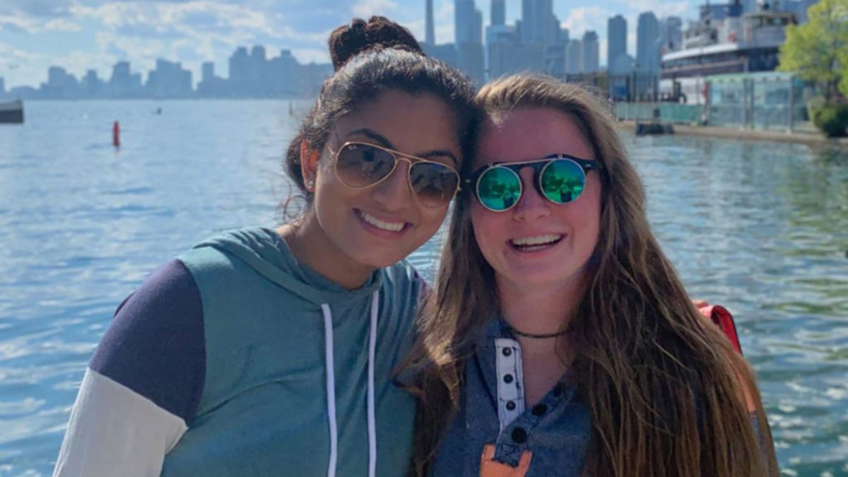 Morehead Scholars Jaya Mishra and Megan Lienau smiling while on location for their Civic Collaboration Summer. 