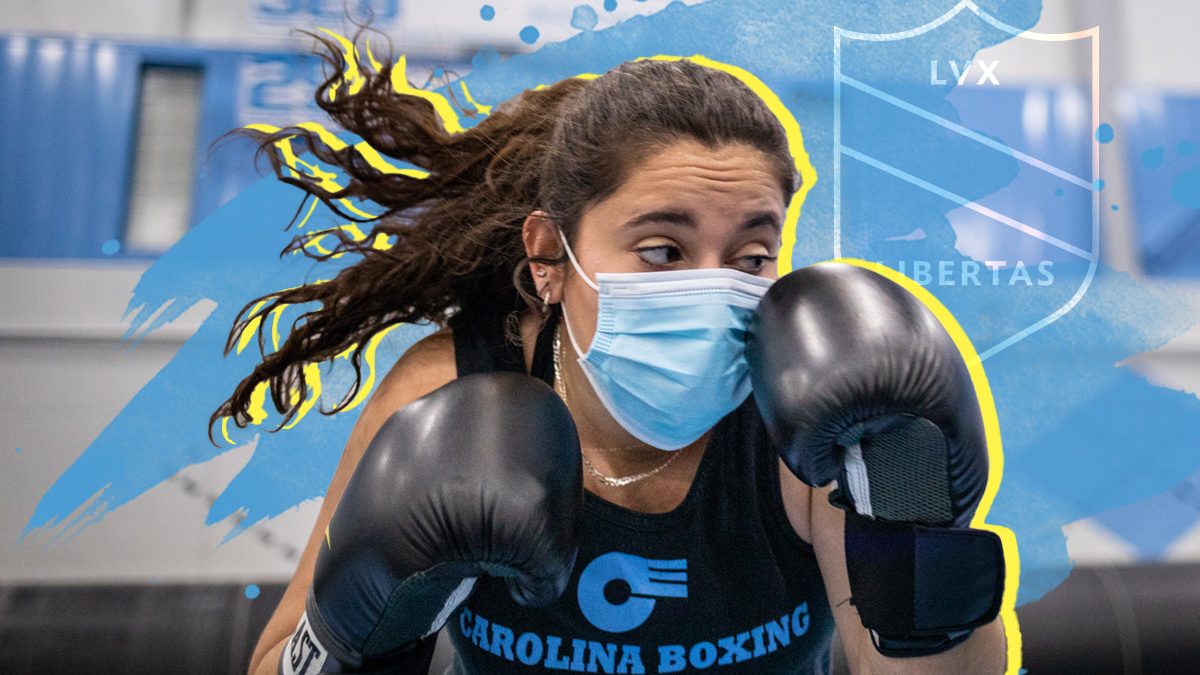 An action shot of Gigi Cloney wearing boxing gloves