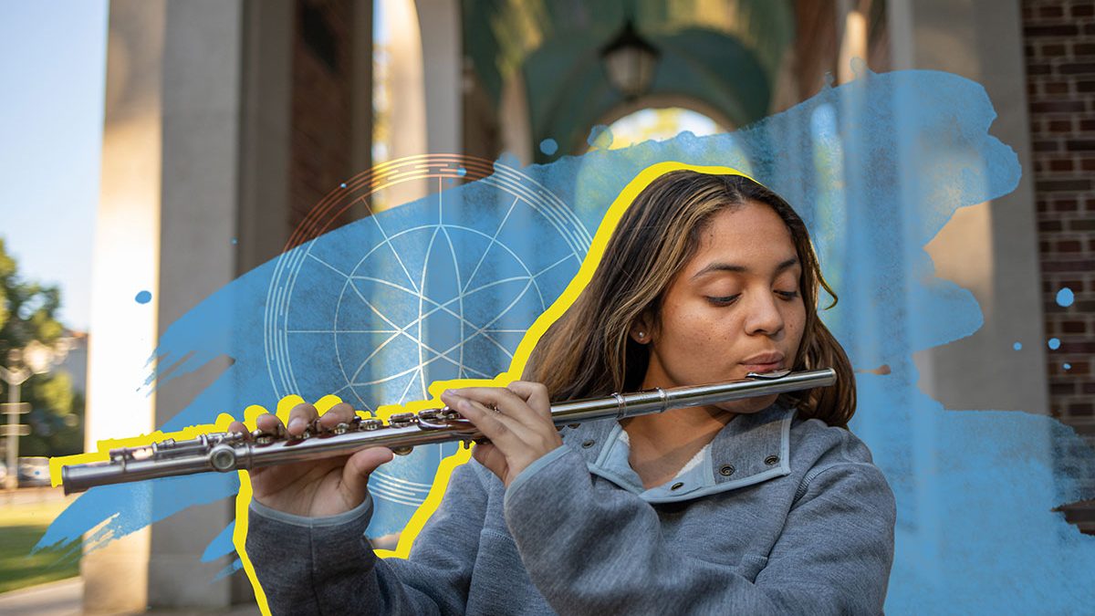 Ashley Medina plays a flute outdoors at Carolina.