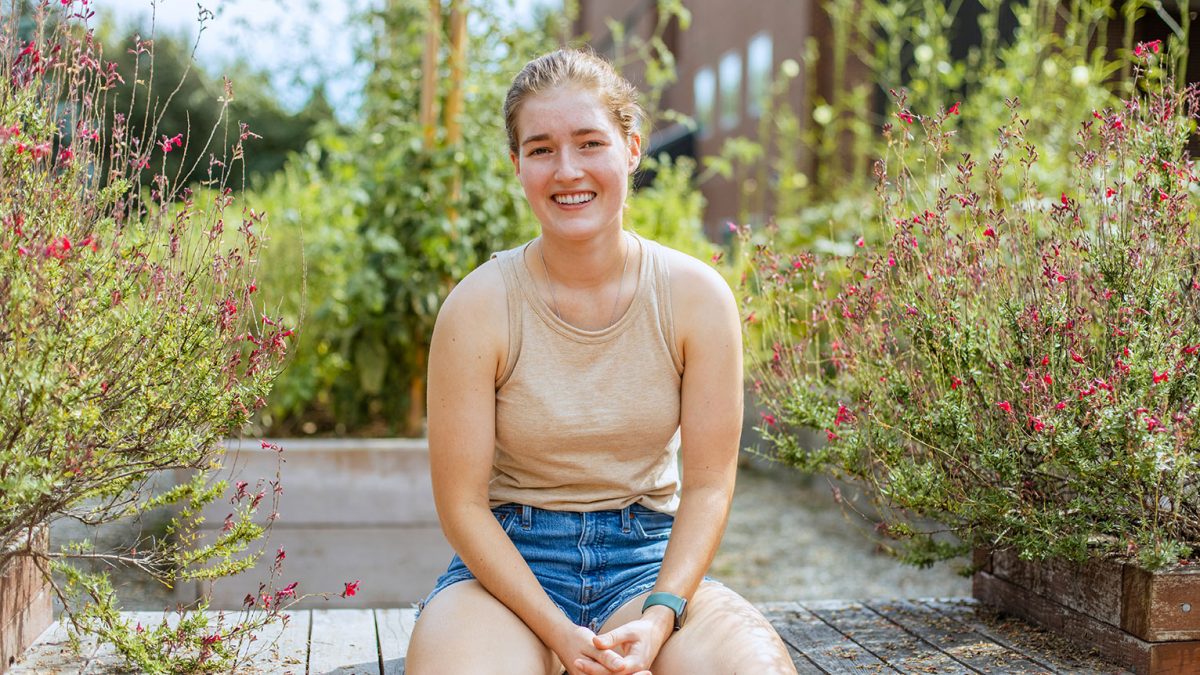 Lydia Rowen sits in garden