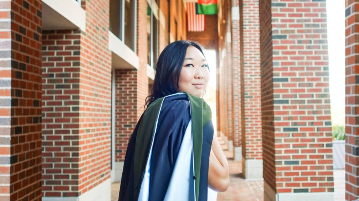 Grace Yook poses in front of Kenan-Flagler Business School