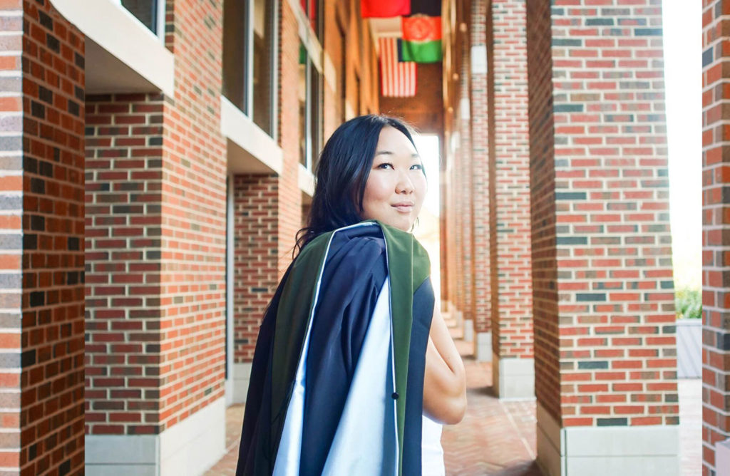Grace Yook poses in front of Kenan-Flagler Business School