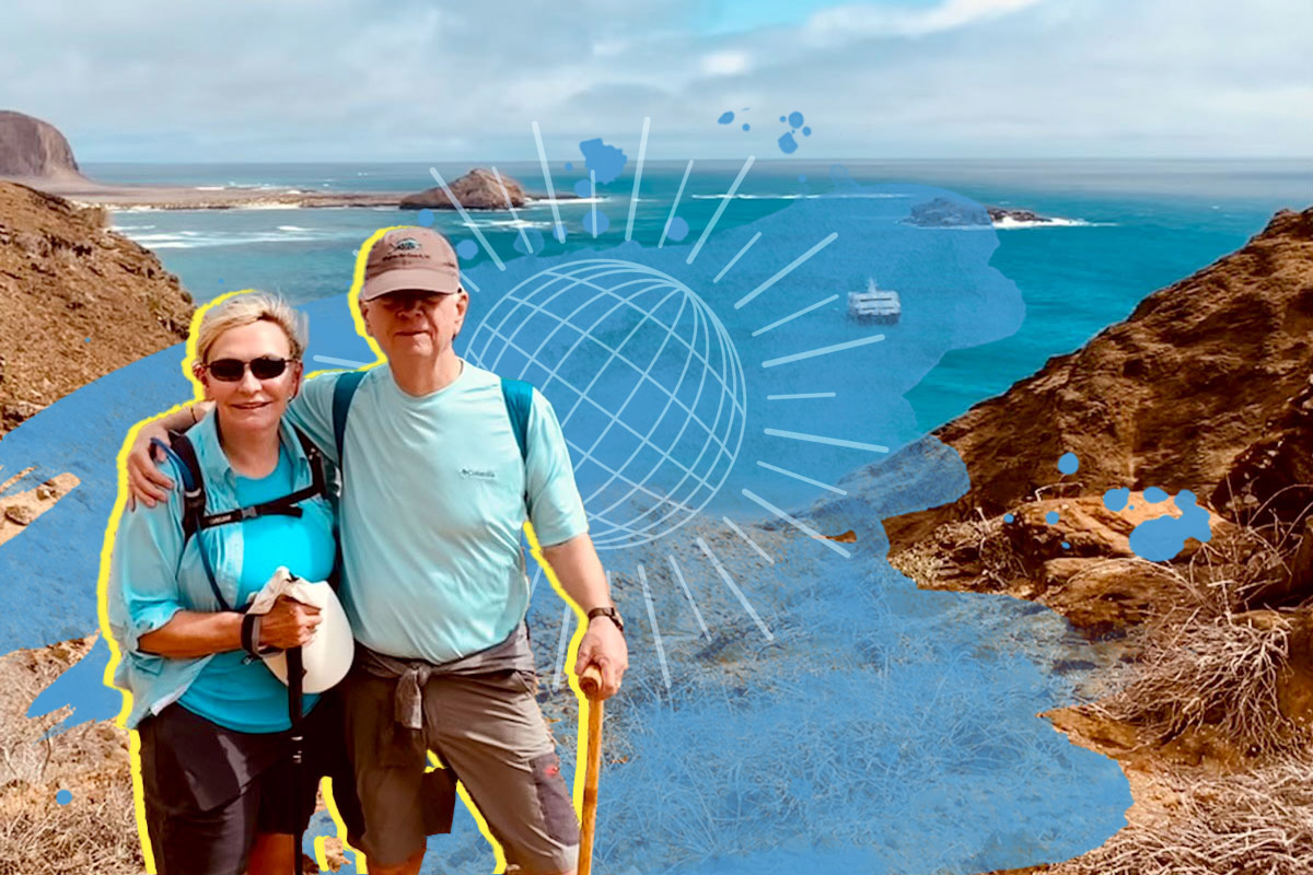 Bettie McKaig and Ross Vaughan pose in front of the ocean in the Galapagos