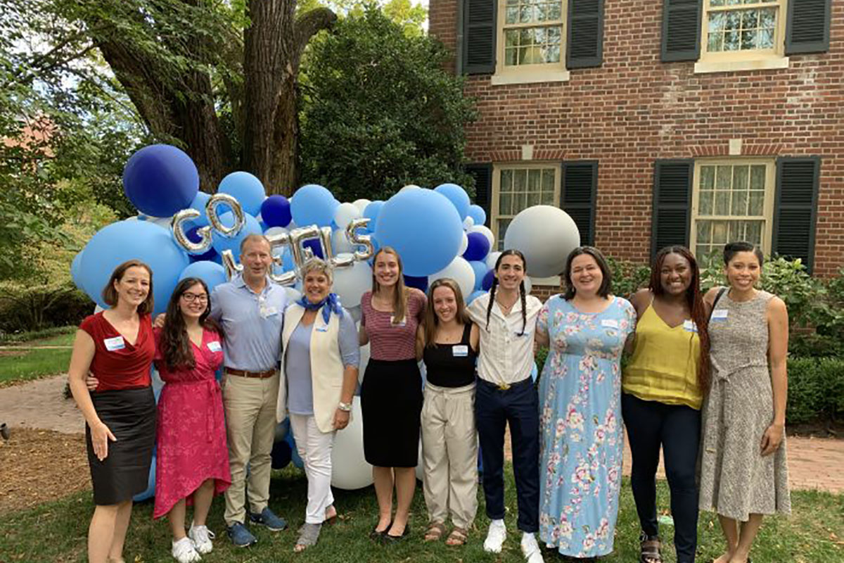 Doug Mackenzie and Dean Terry Rhodes (third and fourth from left) spent time with students at a fellowship gathering in fall 2020.