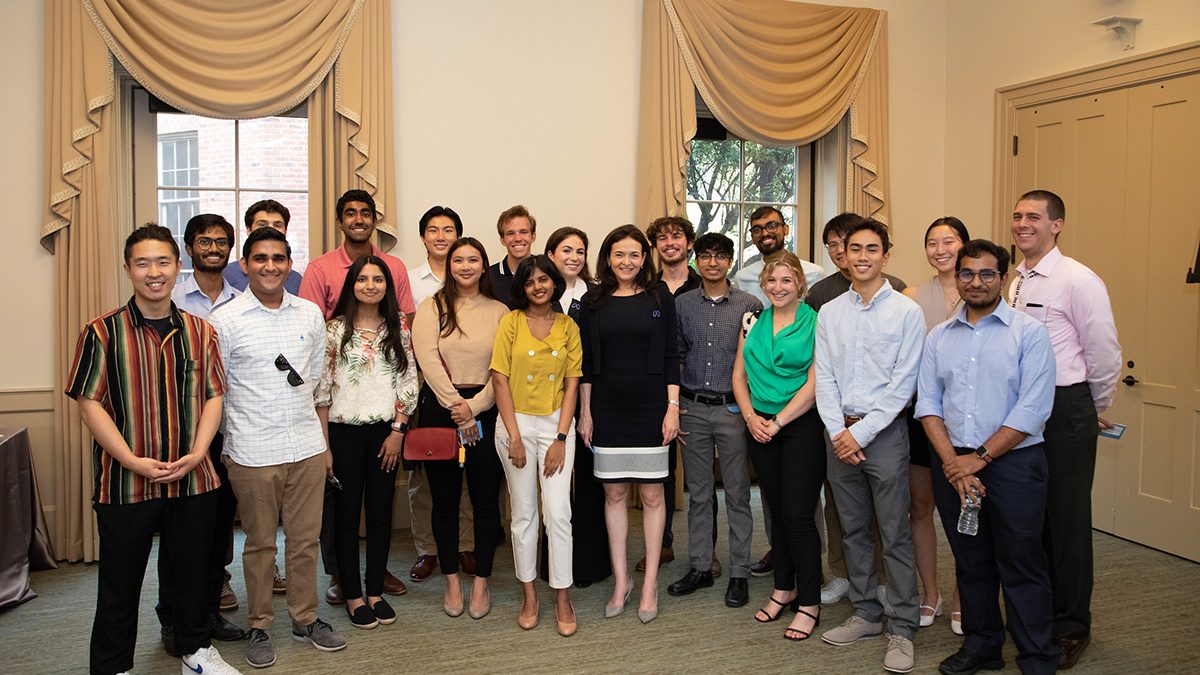 Sandberg stands with a group of Computer Science students in Hyde Hall