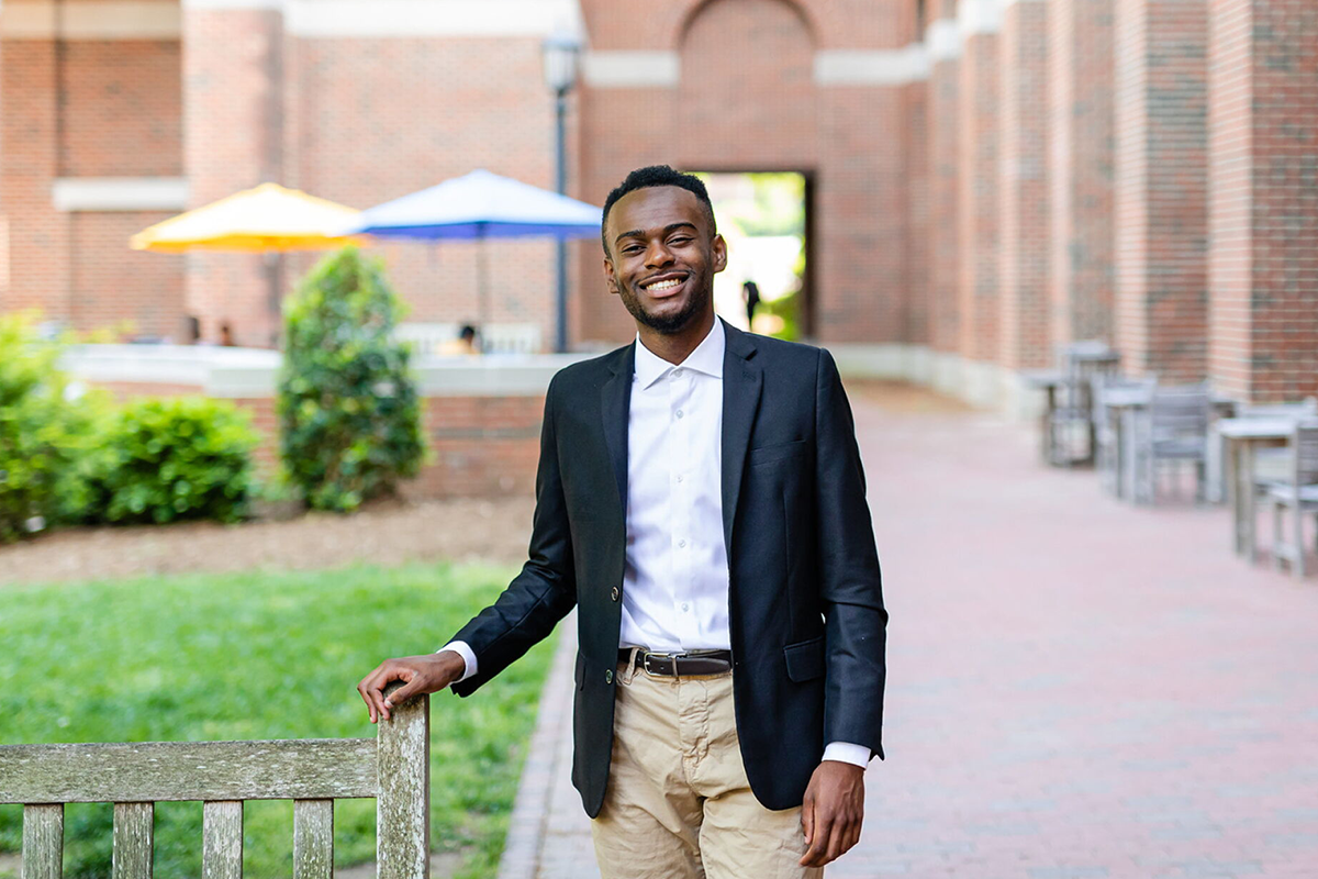 Derek Brown stands in front of Kenan-Flagler Business School