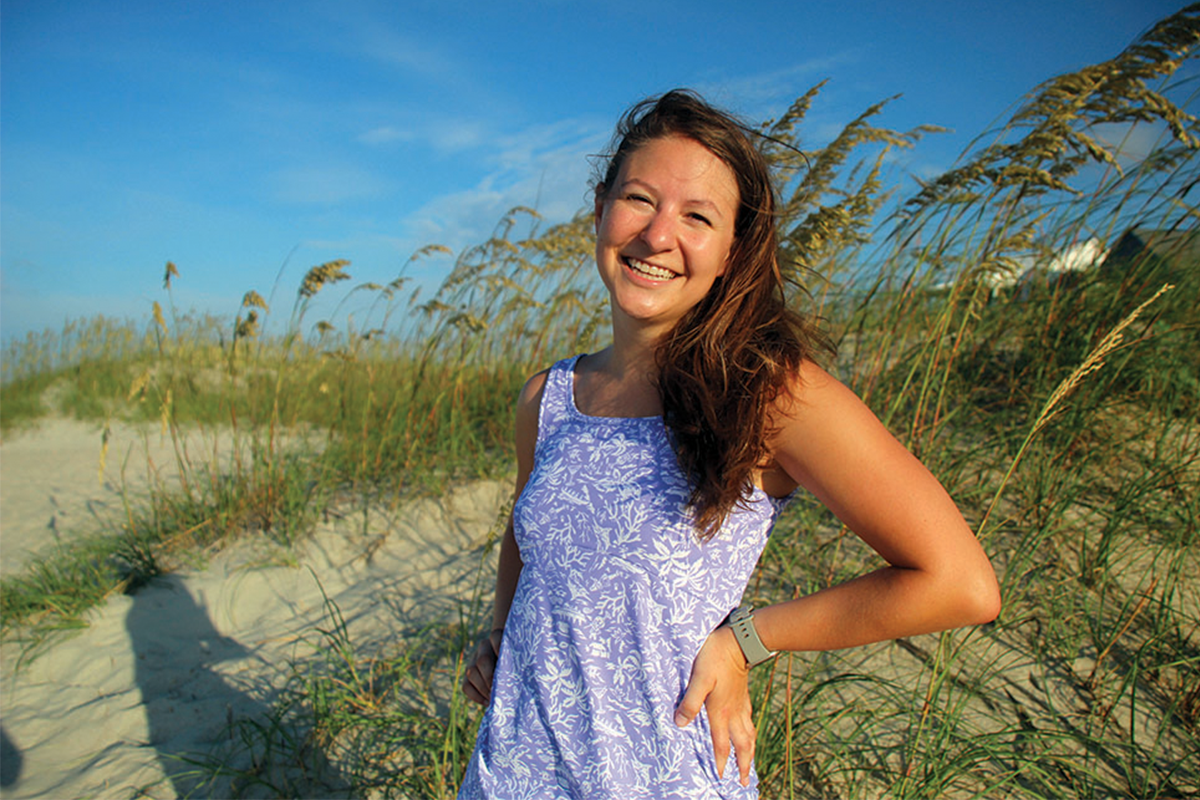 Anna Atencio stands on the shore of NC