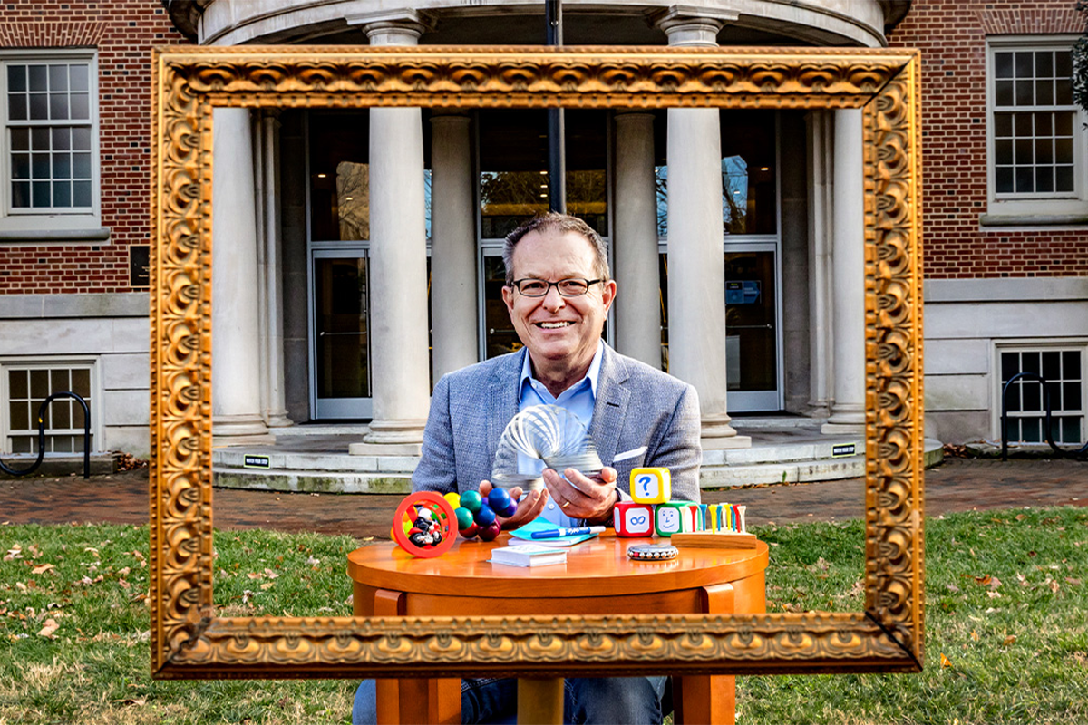 Portrait of Keith Swayer in front of Peabody Hall
