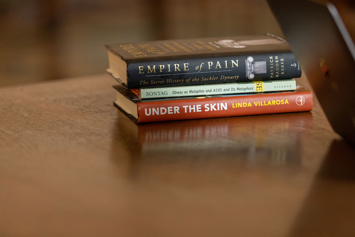 A stack of three books on a table
