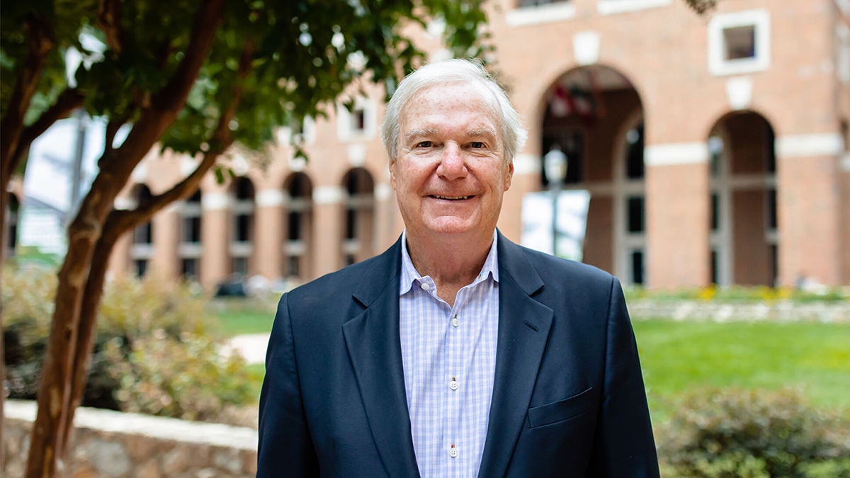 Bill Starling stands in front of the Kenan-Flagler Business School